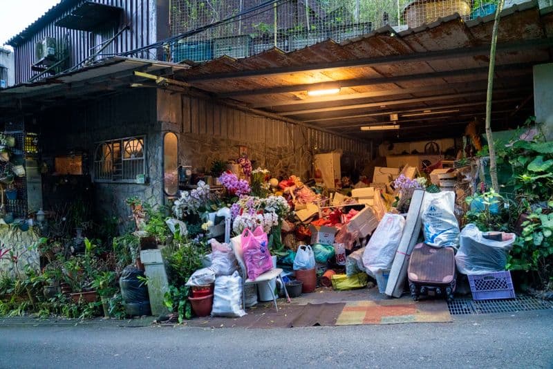 Garage packed floor-to-ceiling with junk — the kind of cleanout we handle